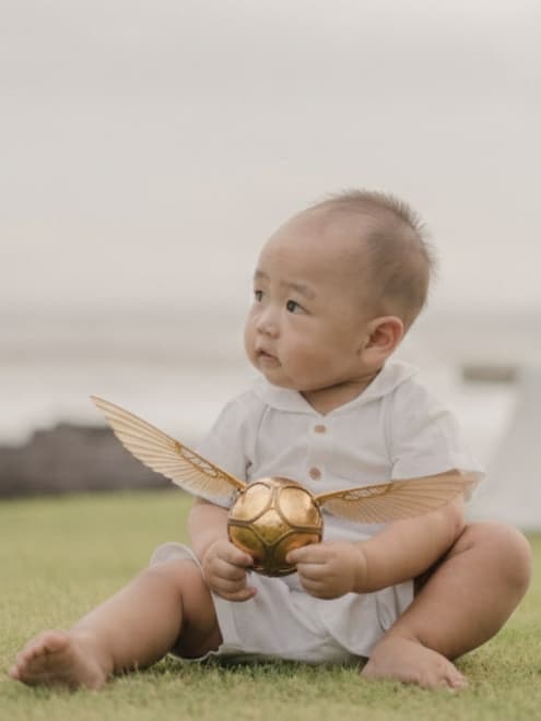 Theodore playing with golden snitch